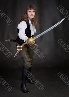The girl - pirate with a sabre in hands
