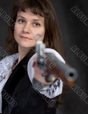 The girl - pirate with ancient pistol in hand