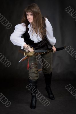 The girl - pirate with a sabre in hands