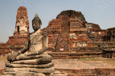 Sitting Buddha in ancient ruins