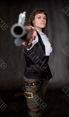 The girl - pirate with ancient pistol in hand