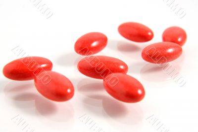 A few medicine tablets on a table