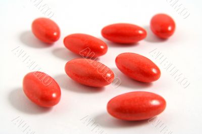 A few medicine tablets on a table