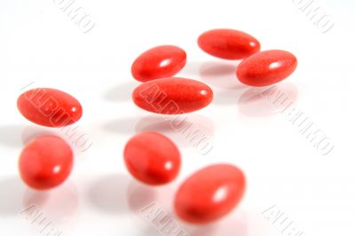 A few medicine tablets on a table