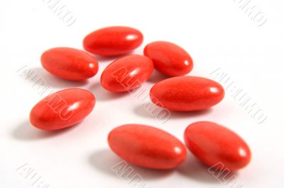 A few medicine tablets on a table A few medicine tablets on a table