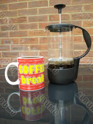 coffee maker and a mug of coffee