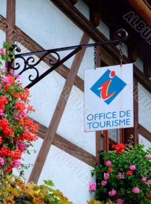 French tourism office sign on half-timbred wall