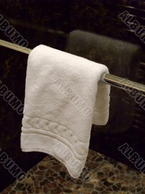 TOWEL HANGING IN A  BATHROOM