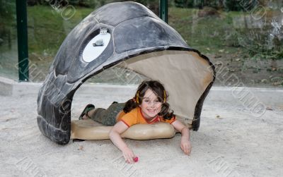 Little girl in the turtle shell