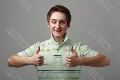 smiling young man with thumbs up smiling young man with thumbs up