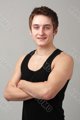 young man with arms across