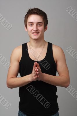 Young man on a grey background.