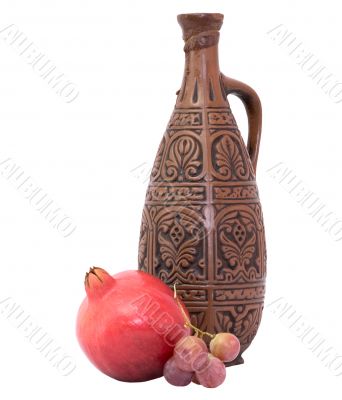 Still-life with a bottle and pomegranate