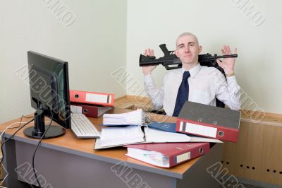 Self-satisfied worker of office armed with a rifle