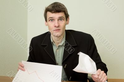Clerk at office with financial graph