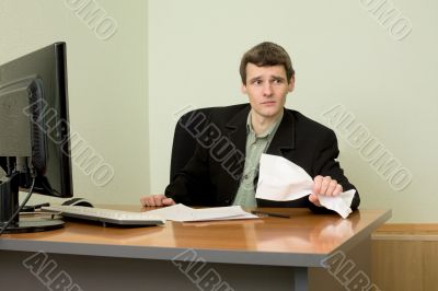 Director on a workplace with a crushed paper