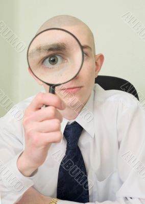 Guy looks through the big magnifier