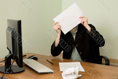 Director on a workplace with a graph