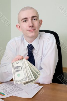 Chief stretching to us a pack of dollars