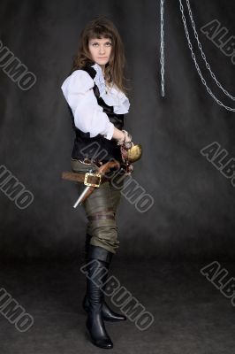 The girl - pirate with a sabre in hands