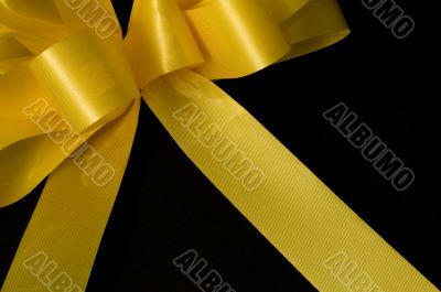 Yellow ribbon on black background