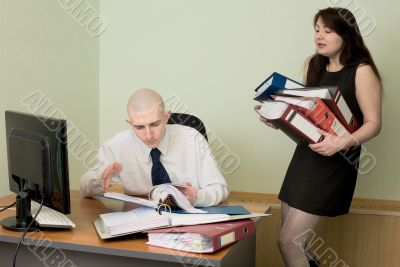 Bookkeeper and the secretary on a workplace