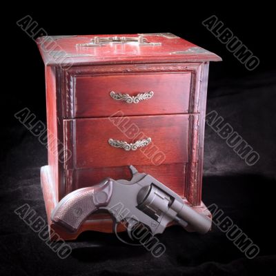 A small box and revolver
