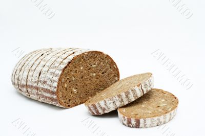 Sliced loaf of cereal bread.
