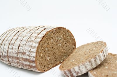 Sliced loaf of cereal bread.