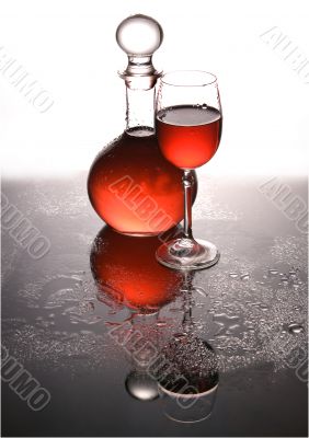 Carafe and a glass with wine. Carafe and a glass with wine.