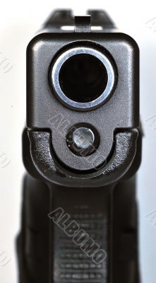 Looking down barrel of semi-automatic handgun