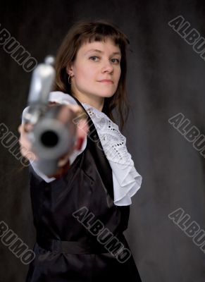 The girl - pirate with ancient pistol in hand