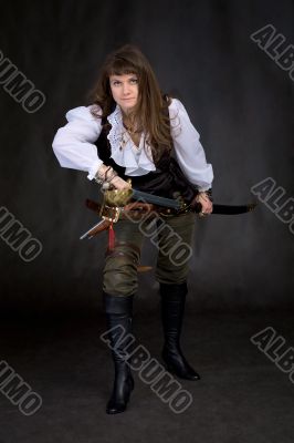 The girl - pirate with a sabre in hands
