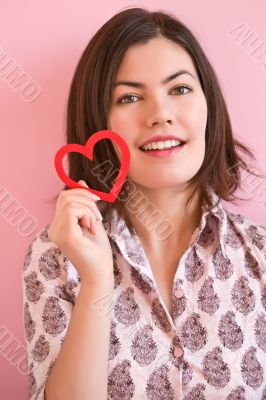 Happy girl holding a heart