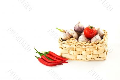 tomatoes, pepper and garlic in a basket