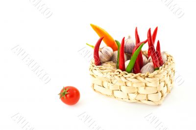 tomato, pepper and garlic in a basket