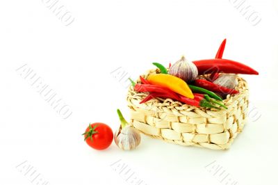 tomatoes, pepper and garlic in a basket