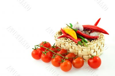 tomatoes, pepper and garlic in a basket