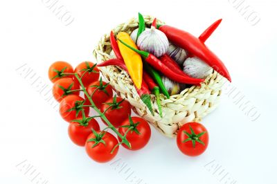 tomatoes, pepper and garlic in a basket