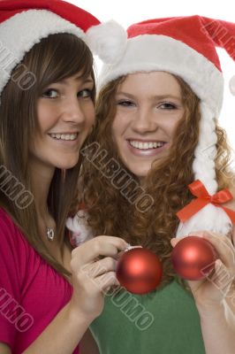 Christmas, happy teenagers with Christmas tree ball