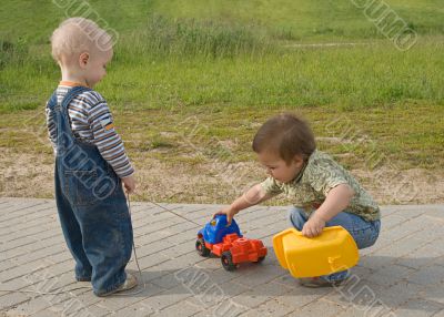 Children with a toy truck
