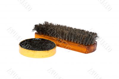 Shoe wax and a brush