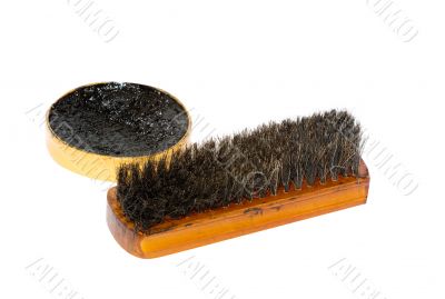 Shoe wax and a brush