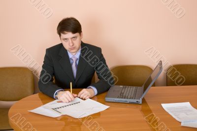 Businessman at a table with laptop