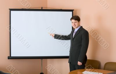 Businessman near the white screen