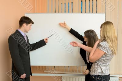 Office workers discuss work