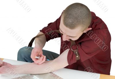 Young man to give an injection himself