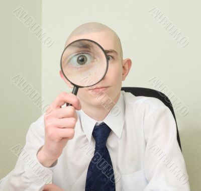 Guy looks through the big magnifier