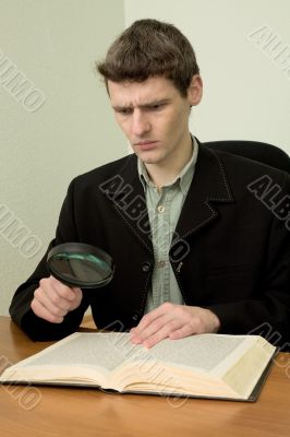 Man read book on a workplace