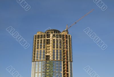 Cranes and building construction of a skyscraper early morning a